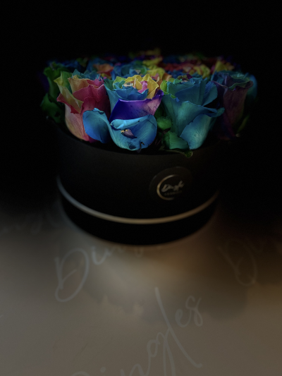 Grand Rainbow Dingles Hatbox - These fresh tinted rainbow roses are arranged by a qualified Dingle’s Florist in Oasis floral foam and finished with sparkling pins in the centre of each rose.