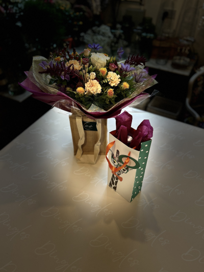 Autumn by Dingles - Send them full autumn colour on a grey day with a handcrafted, radiant bouquet. Bursting with the richest colours of the season, expect to see blooms in shades of ruby, amber, mustard and plum. Why not add the champagne on at the checkout also?