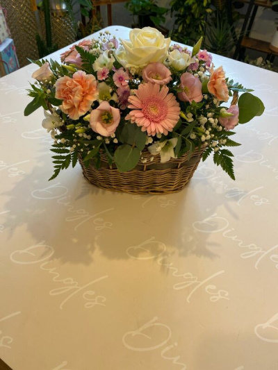 Just Because - A pretty collection of timeless, favourite flowers skilfully arranged in a beautiful basket to send your message in a wonderful way. We cannot guarantee what the flower varieties or colours will be, We do guarantee that your specific arrangement will be fresh, beautiful and that your recipient will love it!