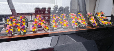 Loose Letter Tribute - A beautiful and personalised loose letter funeral tribute, designed to spell out a name or meaningful word using individually crafted floral letters. Each letter is carefully hand-arranged with a vibrant mix of fresh flowers.