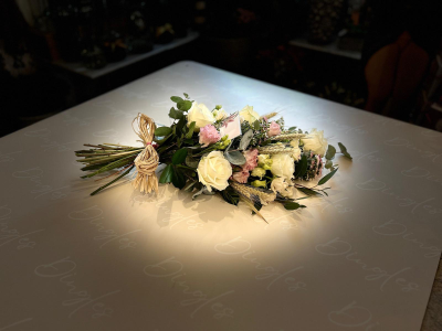 Funeral Sheaf - A beautifully arranged hand-tied funeral sheaf, featuring a soft and elegant selection of fresh flowers in delicate, neutral tones.